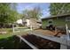 Fenced backyard area with a garden and an open yard at 5041 Norcroft Dr, Indianapolis, IN 46221
