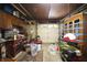 Functional garage space with storage cabinets, workbench, and overhead door, ideal for projects and parking at 5041 Norcroft Dr, Indianapolis, IN 46221