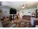Cozy living room featuring comfortable seating, a ceiling fan, and wood laminate flooring at 5041 Norcroft Dr, Indianapolis, IN 46221