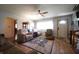Inviting living room with natural light, comfortable seating, and laminate wood floor at 5041 Norcroft Dr, Indianapolis, IN 46221