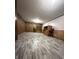 Finished basement with stylish gray flooring, wood-paneled walls, and built-in shelving at 518 Cherry St, Beech Grove, IN 46107