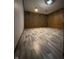 Spacious basement area with wood-paneled walls and stylish gray flooring at 518 Cherry St, Beech Grove, IN 46107