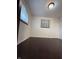 Bedroom features hardwood floors and a window, providing a simple and functional space at 518 Cherry St, Beech Grove, IN 46107