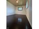 Bedroom features hardwood floors and a window, providing a simple and functional space at 518 Cherry St, Beech Grove, IN 46107