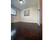 Bedroom features hardwood floors and a window, providing a simple and functional space at 518 Cherry St, Beech Grove, IN 46107