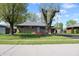 Charming single-story home featuring a well-manicured lawn and inviting curb appeal at 518 Cherry St, Beech Grove, IN 46107
