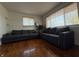 Living room with hardwood floors, two windows, and modern gray couches at 518 Cherry St, Beech Grove, IN 46107