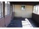 Enclosed porch featuring screens, a door and wood flooring at 518 Cherry St, Beech Grove, IN 46107