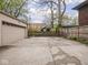 Spacious backyard featuring a playground set, wooden fence, and a detached two car garage at 5181 E Pleasant Run Pkwy S Dr, Indianapolis, IN 46219