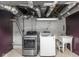 Basement laundry room with modern washer and dryer at 5181 E Pleasant Run Pkwy S Dr, Indianapolis, IN 46219