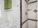 This tiled bathroom features vintage fixtures, a built-in cabinet and shower at 5181 E Pleasant Run Pkwy S Dr, Indianapolis, IN 46219