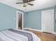 Bedroom featuring hardwood floors, a ceiling fan, and ample natural light at 5181 E Pleasant Run Pkwy S Dr, Indianapolis, IN 46219