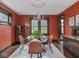 Dining room with seating for four, with stained glass window and a chandelier at 5181 E Pleasant Run Pkwy S Dr, Indianapolis, IN 46219