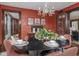 Dining room with a modern table, seating for four, and views of the living room at 5181 E Pleasant Run Pkwy S Dr, Indianapolis, IN 46219