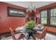 Dining room featuring a black table with chairs and a beautiful chandelier at 5181 E Pleasant Run Pkwy S Dr, Indianapolis, IN 46219