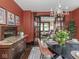 Dining room featuring a service counter and an archway leading to the living room at 5181 E Pleasant Run Pkwy S Dr, Indianapolis, IN 46219