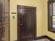 Entryway with wood trim, a closet, and a window at 5181 E Pleasant Run Pkwy S Dr, Indianapolis, IN 46219