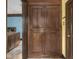 Entryway featuring wood cabinets, tile floors, and classic wood trim at 5181 E Pleasant Run Pkwy S Dr, Indianapolis, IN 46219