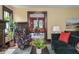 Comfortable living room with a decorative fireplace, and view of the dining room at 5181 E Pleasant Run Pkwy S Dr, Indianapolis, IN 46219