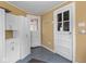 Mudroom with a blue floor, white cabinetry, and two exterior doors at 5181 E Pleasant Run Pkwy S Dr, Indianapolis, IN 46219