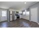 Modern kitchen featuring stainless steel appliances, white cabinetry, and stylish backsplash at 5515 W Morris St, Indianapolis, IN 46241