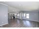 Bright living space seamlessly connects with kitchen, featuring stainless steel appliances and ample natural light at 5515 W Morris St, Indianapolis, IN 46241
