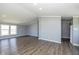 Open-concept living space with hardwood floors and ample natural light throughout at 5515 W Morris St, Indianapolis, IN 46241