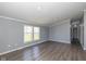 Inviting living space with a bright interior, hardwood flooring, and recessed lighting at 5515 W Morris St, Indianapolis, IN 46241