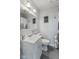 Cozy bathroom with vanity, decorative mirror, and a shower with modern fixtures at 57 Hadley St, Mooresville, IN 46158