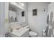Cozy bathroom with vanity, decorative mirror, and a shower with modern fixtures at 57 Hadley St, Mooresville, IN 46158