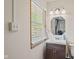 Cozy bathroom features a modern vanity with storage and natural light from the window at 57 Hadley St, Mooresville, IN 46158