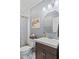 Bathroom featuring a framed mirror, stylish vanity, and charming vintage-inspired decor at 57 Hadley St, Mooresville, IN 46158