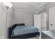 Neutral bedroom with a bed, side table, and natural light at 57 Hadley St, Mooresville, IN 46158