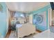 Bright bedroom with teal walls, a white bed frame, and a decorative tapestry at 57 Hadley St, Mooresville, IN 46158
