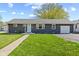 Charming single-story home with a well-manicured lawn and inviting curb appeal at 57 Hadley St, Mooresville, IN 46158