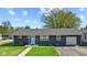 Charming single story home with tidy lawn, new gray paint, and stylish front door at 57 Hadley St, Mooresville, IN 46158
