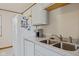 Well-lit kitchen features a stainless steel sink, modern appliances, and ample countertop space at 57 Hadley St, Mooresville, IN 46158