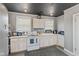 Charming kitchen featuring white cabinets, modern appliances, and plenty of counter space at 57 Hadley St, Mooresville, IN 46158