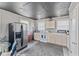 Functional kitchen with a refrigerator, oven, and ample counter space at 57 Hadley St, Mooresville, IN 46158