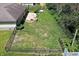 Aerial view of the backyard featuring a stone fire pit and surrounding greenery at 601 Shady Ln, Greenwood, IN 46142