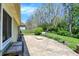 Spacious backyard featuring a large patio area, lush greenery, and a serene wooded backdrop at 601 Shady Ln, Greenwood, IN 46142