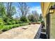 Backyard featuring large patio, fire pit, manicured landscaping and green lawn at 601 Shady Ln, Greenwood, IN 46142
