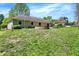 Spacious backyard with a stone fire pit and patio area, perfect for outdoor entertaining at 601 Shady Ln, Greenwood, IN 46142