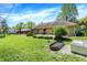 Large backyard featuring a stone fire pit area and ample green space at 601 Shady Ln, Greenwood, IN 46142