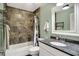 Bathroom featuring shower-tub combination with stylish tile and neutral walls at 601 Shady Ln, Greenwood, IN 46142
