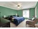 Inviting bedroom with a large window, ceiling fan, and soft carpeting at 601 Shady Ln, Greenwood, IN 46142