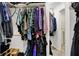 Walk-in closet with ample hanging space and access to additional storage at 601 Shady Ln, Greenwood, IN 46142