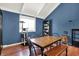 Dining room with natural light, hardwood floors, and a cat tree at 601 Shady Ln, Greenwood, IN 46142