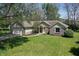 Inviting single-story home with attached two-car garage and a large front yard at 601 Shady Ln, Greenwood, IN 46142