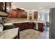 Kitchen with natural stone accents, stainless steel appliances, and ample storage at 601 Shady Ln, Greenwood, IN 46142